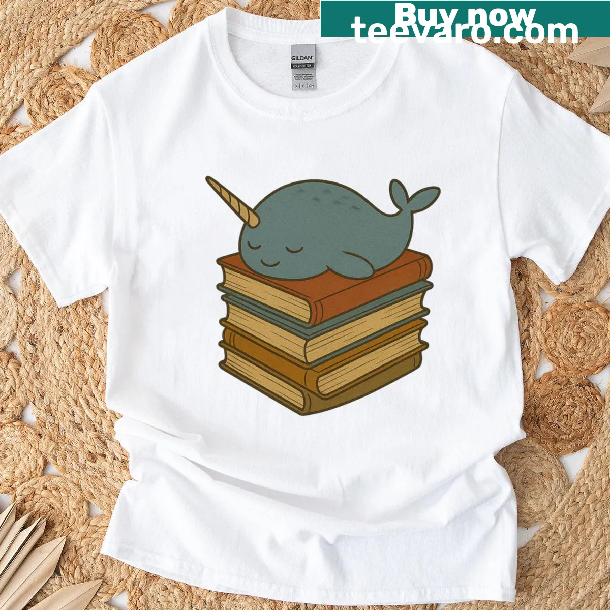 Illustration of a cozy narwhal on a stack of books — on a men's t-shirt
