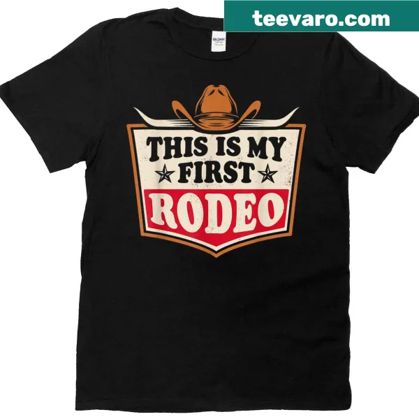 Western-themed T-shirt with 'This Is My First Rodeo' text and hat graphics.