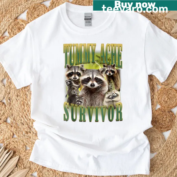 Funny T-shirt with raccoon graphic and meme text about surviving tummy aches.