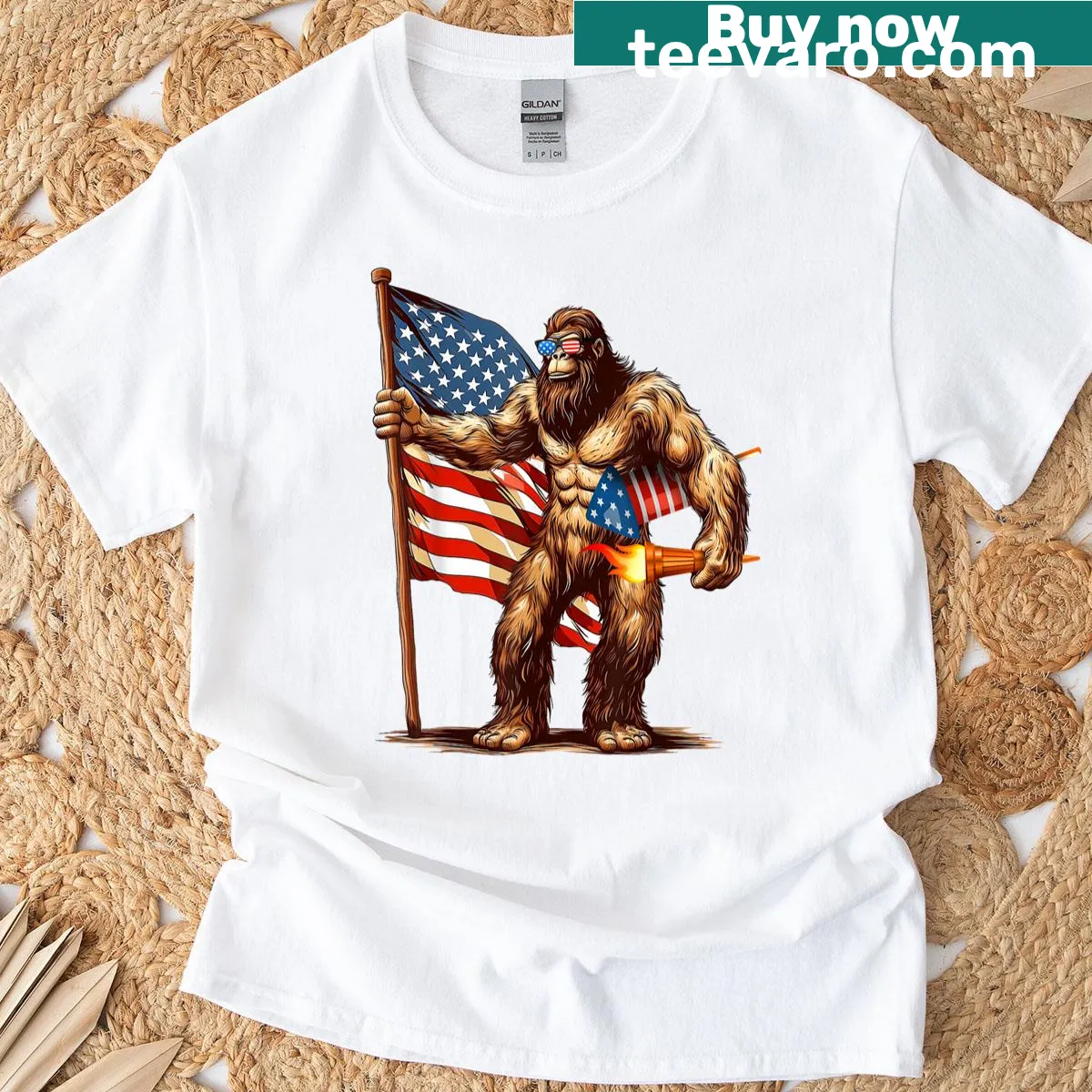 Bigfoot graphic under fireworks with American flag elements — on a men's t-shirt