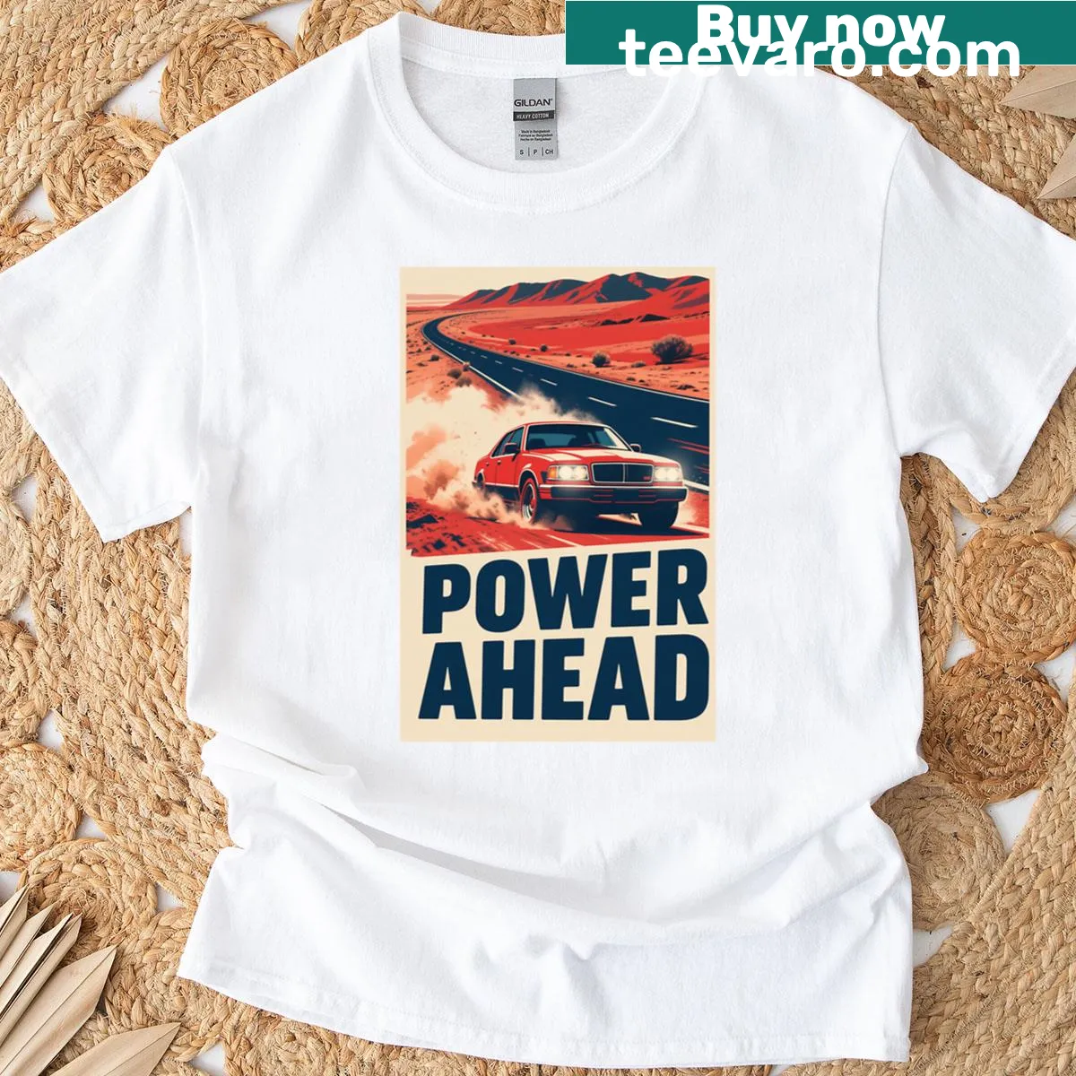 Bold T-shirt featuring a graphic of a muscle car speeding through a desert. — on a men's t-shirt