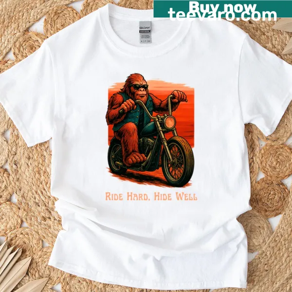 Sasquatch riding motorcycle into sunset t-shirt design