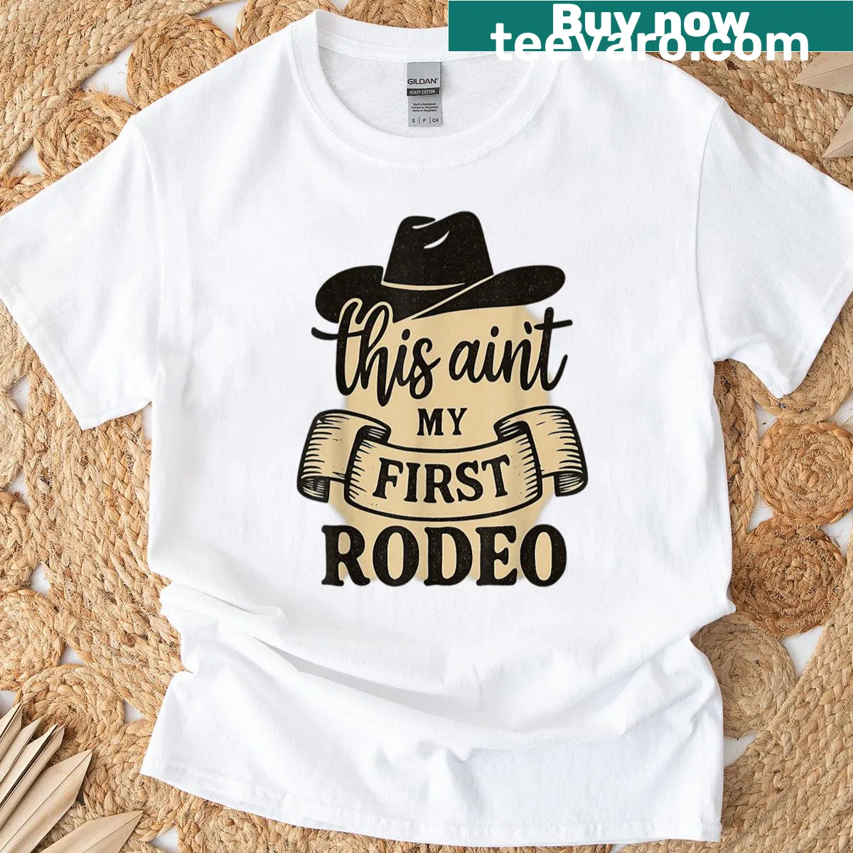 Funny Western T-shirt with the phrase 'This Ain't My First Rodeo.' — on a men's t-shirt