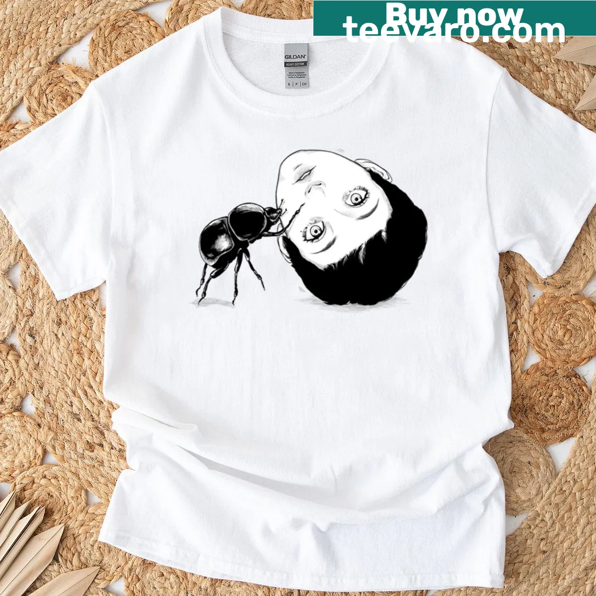 Line-art graphic of a head-rolling beetle on a T-shirt — on a men's t-shirt