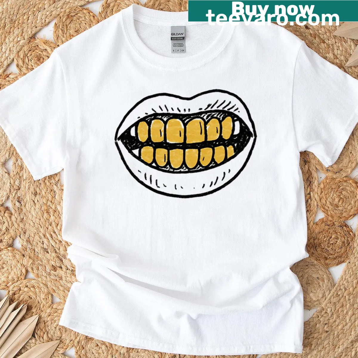 Graphic design of bold gold grillz on a T-shirt — on a men's t-shirt