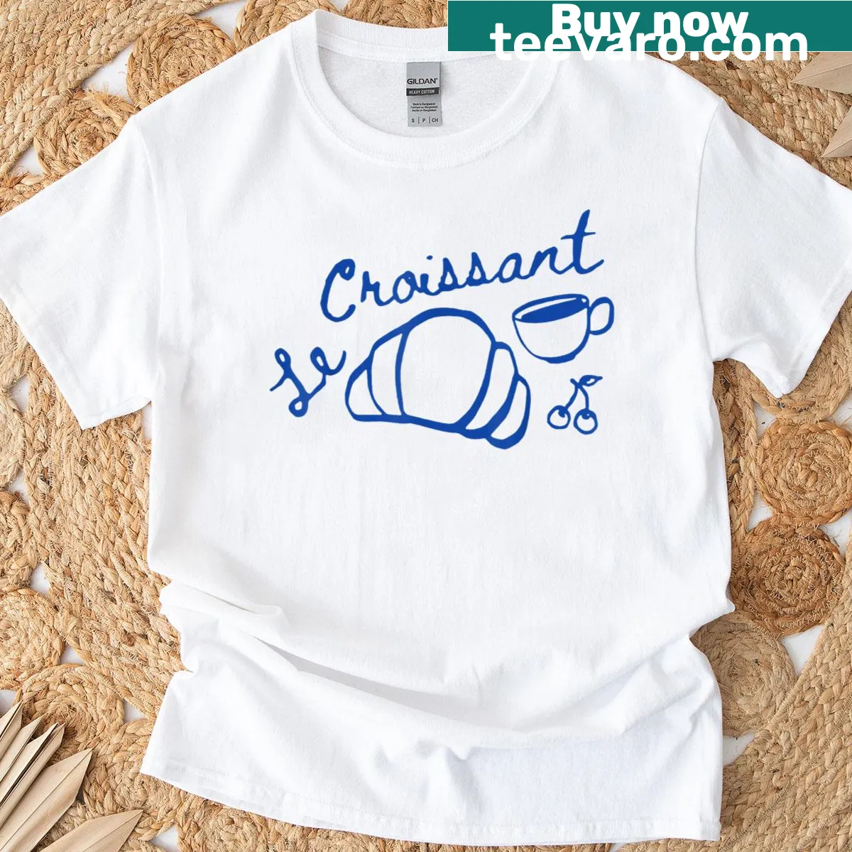 T-shirt featuring a retro graphic of coffee and croissants — on a men's t-shirt