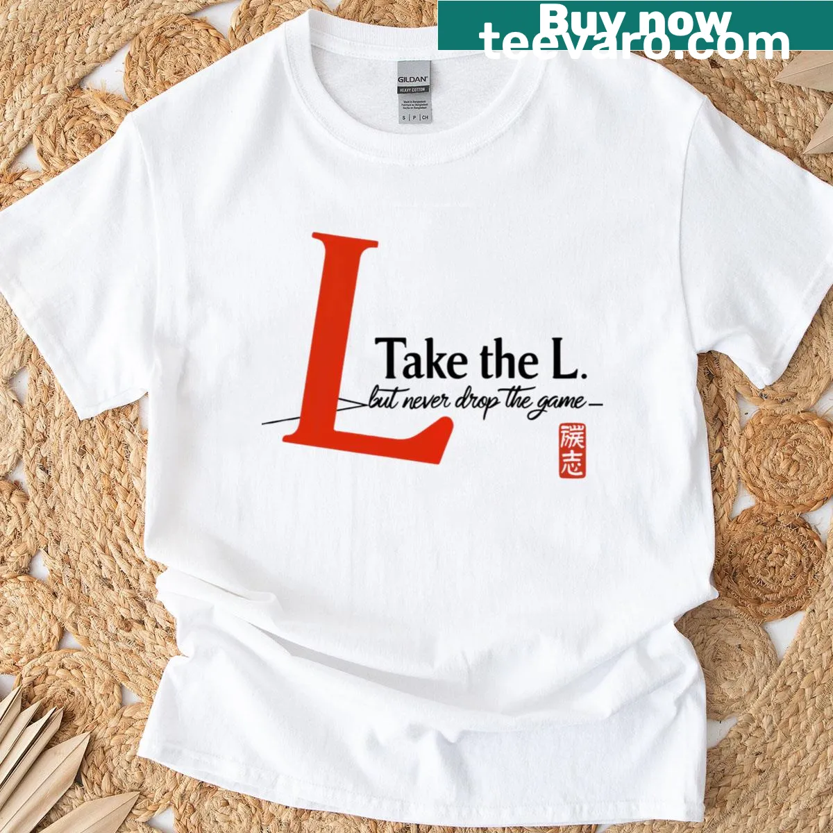 Minimalist typography t-shirt with 'Take The L Never Drop The Game' — on a men's t-shirt