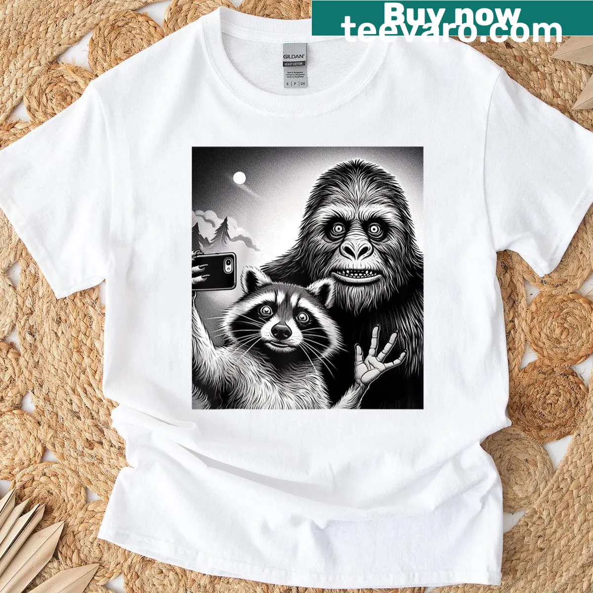 Cartoon Sasquatch taking a selfie with a raccoon — on a men's t-shirt