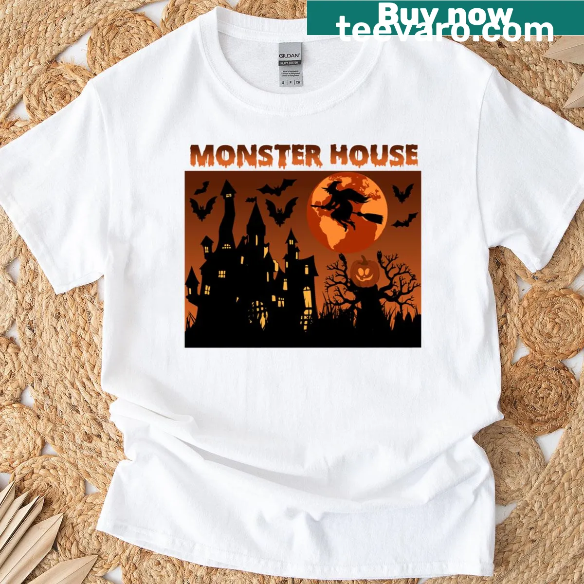 Halloween-themed T-shirt featuring a playful illustrated monster house — on a men's t-shirt