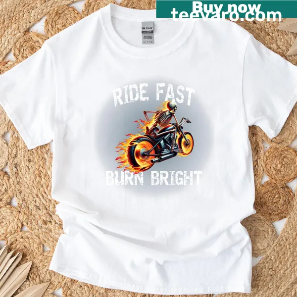 Skeleton biker graphic on a T-shirt with flames and bold text.