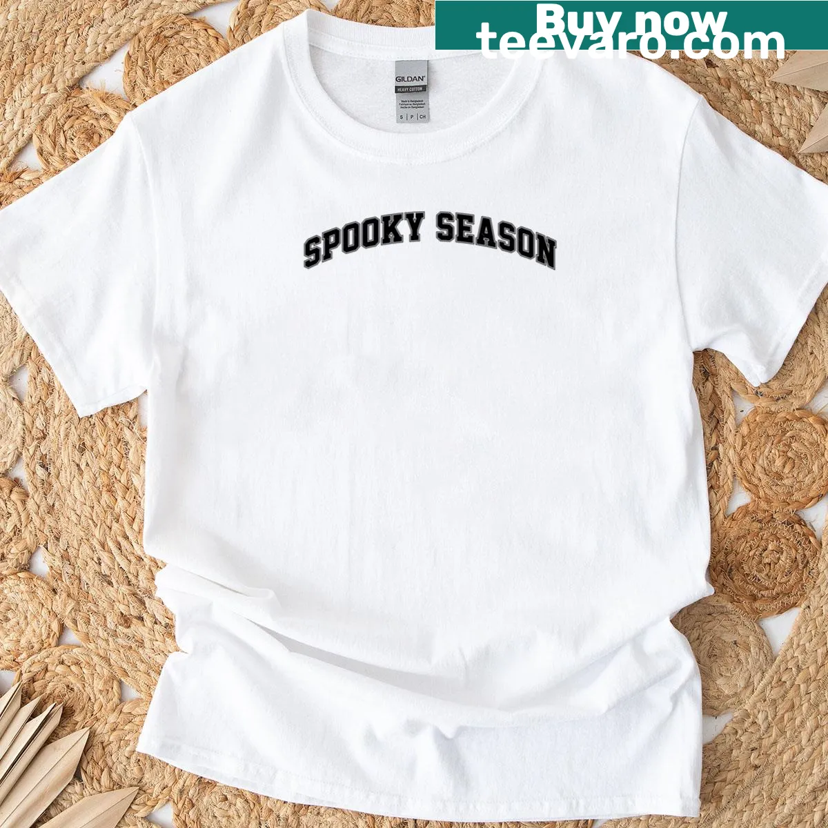Varsity style T-shirt with spooky season lettering — on a men's t-shirt