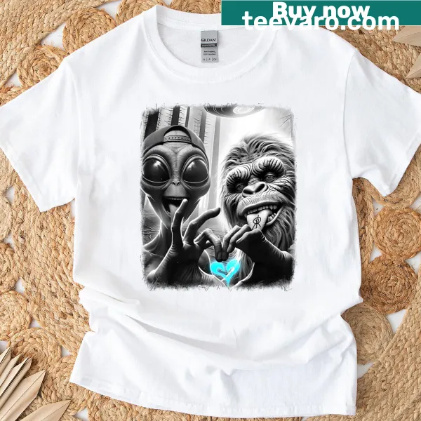 Funny illustration of Bigfoot and alien love hand sign on a T-shirt
