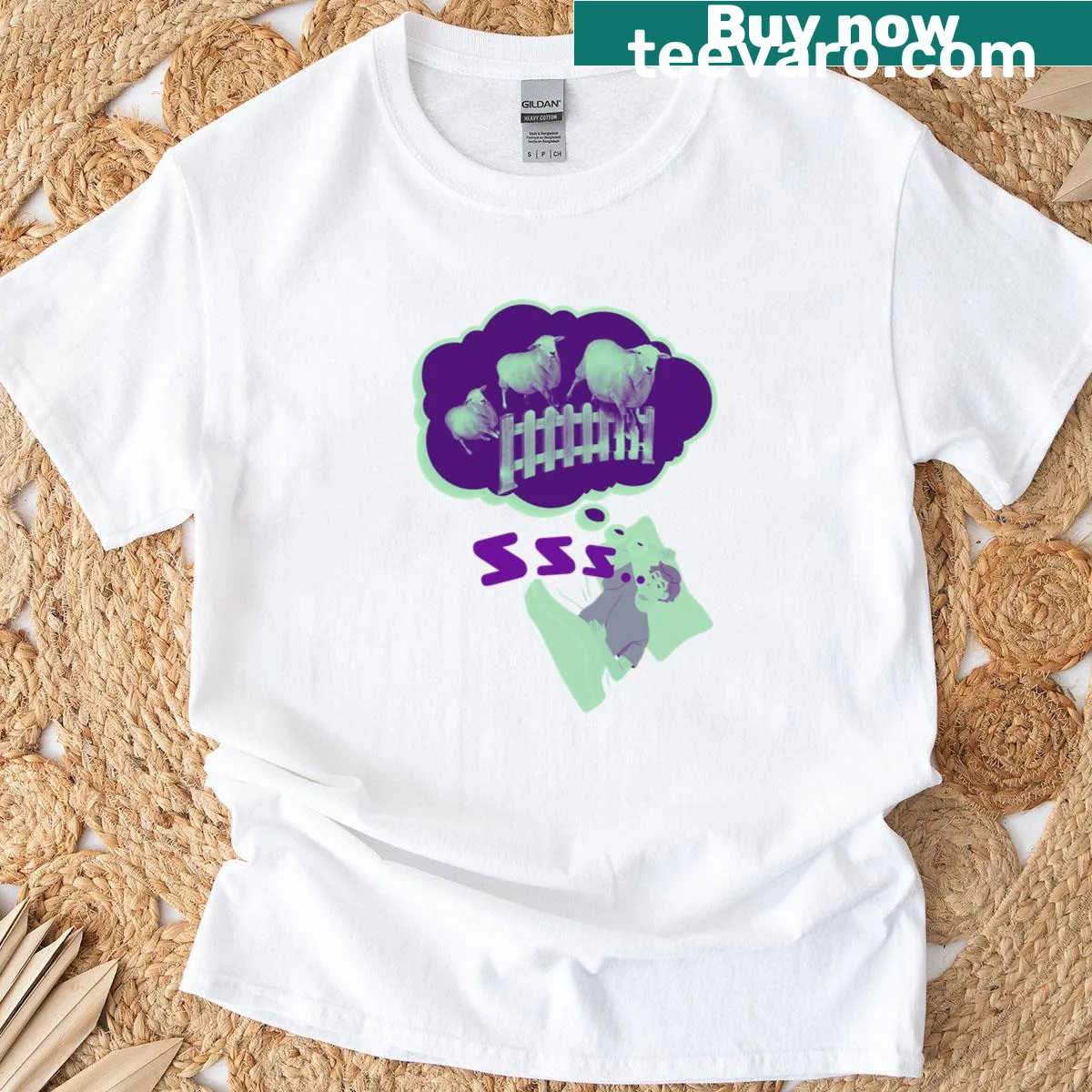 T-shirt featuring a sheep sleeping next to a farmer. — on a men's t-shirt