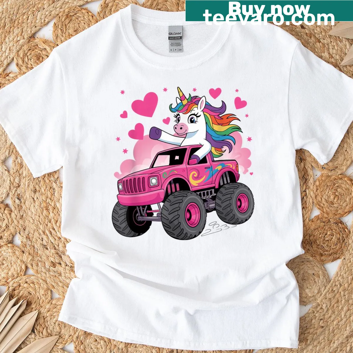 Cartoon T-shirt featuring a unicorn riding a pink monster truck — on a men's t-shirt