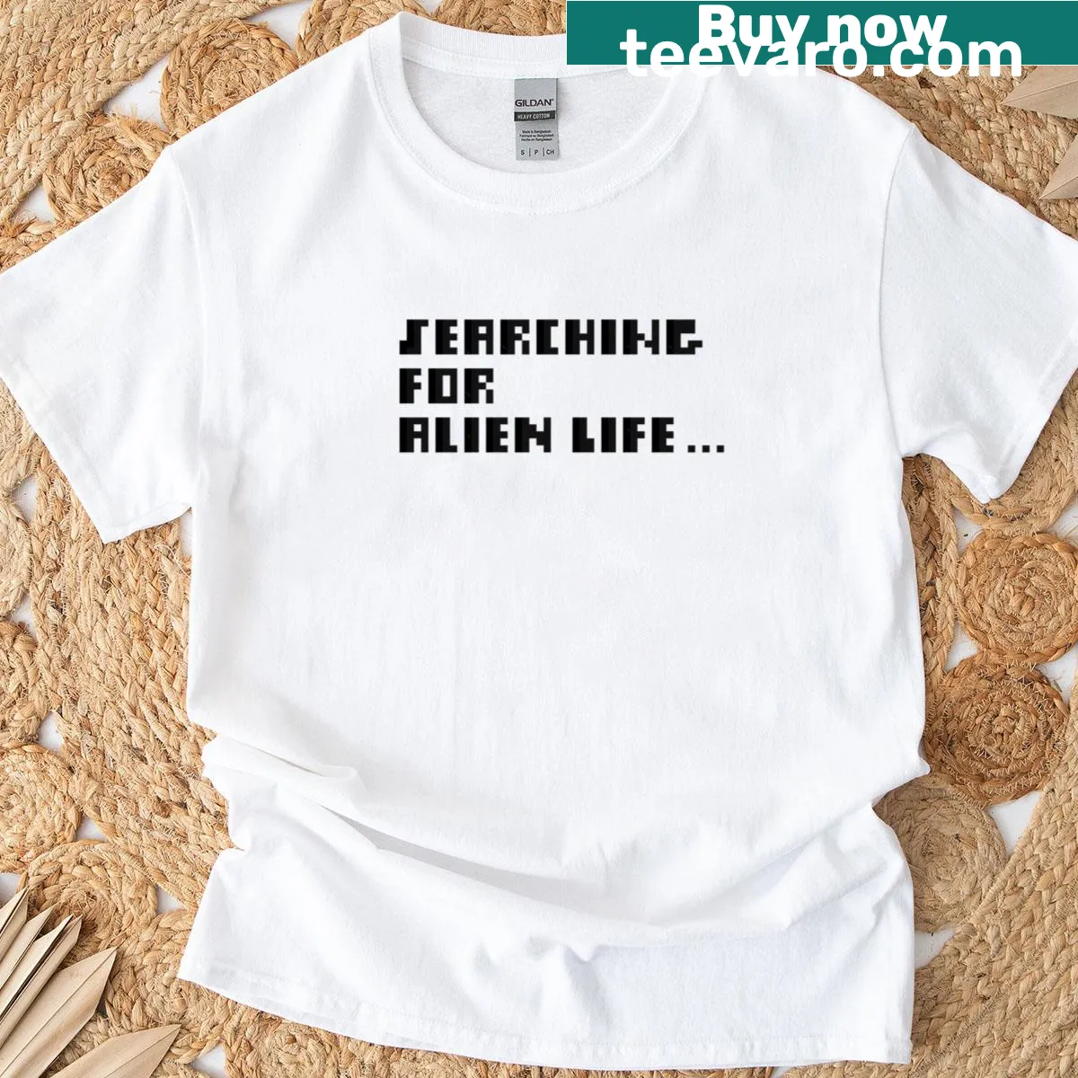 Playful pixel art t-shirt featuring a sci-fi quote about alien life. — on a men's t-shirt