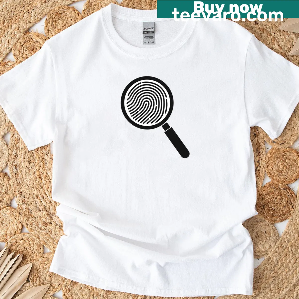 Minimalist t-shirt featuring a line-art design of Sherlock Holmes with a magnifying glass. — on a men's t-shirt