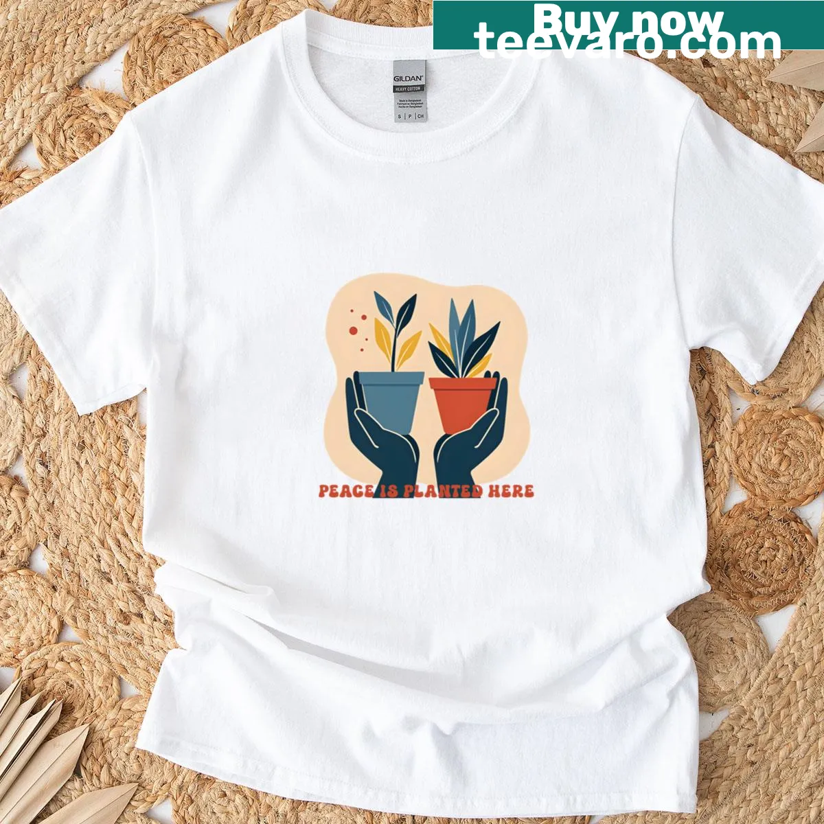T-shirt featuring the phrase 'Peace Is Planted Here' in inviting typography — on a men's t-shirt
