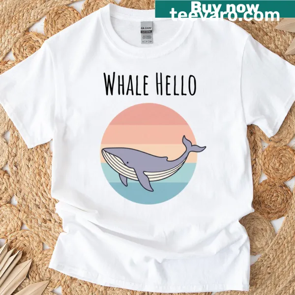 Playful whale graphic with 'Whale, Hello!' text on a T-shirt
