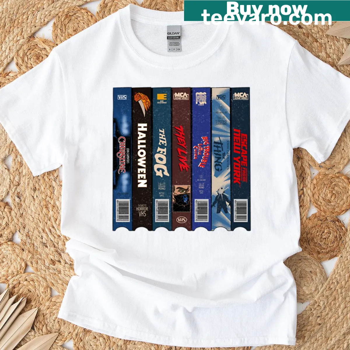 Vintage distressed t-shirt featuring John Carpenter VHS art — on a men's t-shirt