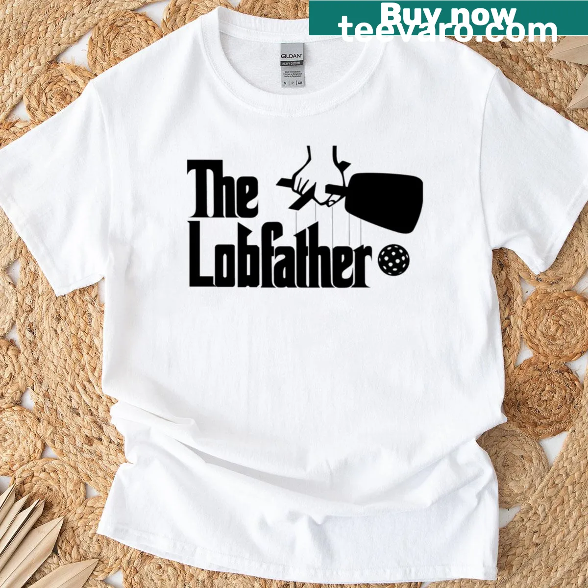 Playful black-and-white graphic t-shirt themed around pickleball and lob shots. — on a men's t-shirt