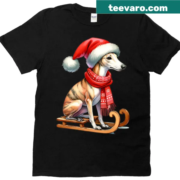 Christmas T-shirt featuring a Whippet riding on a sled