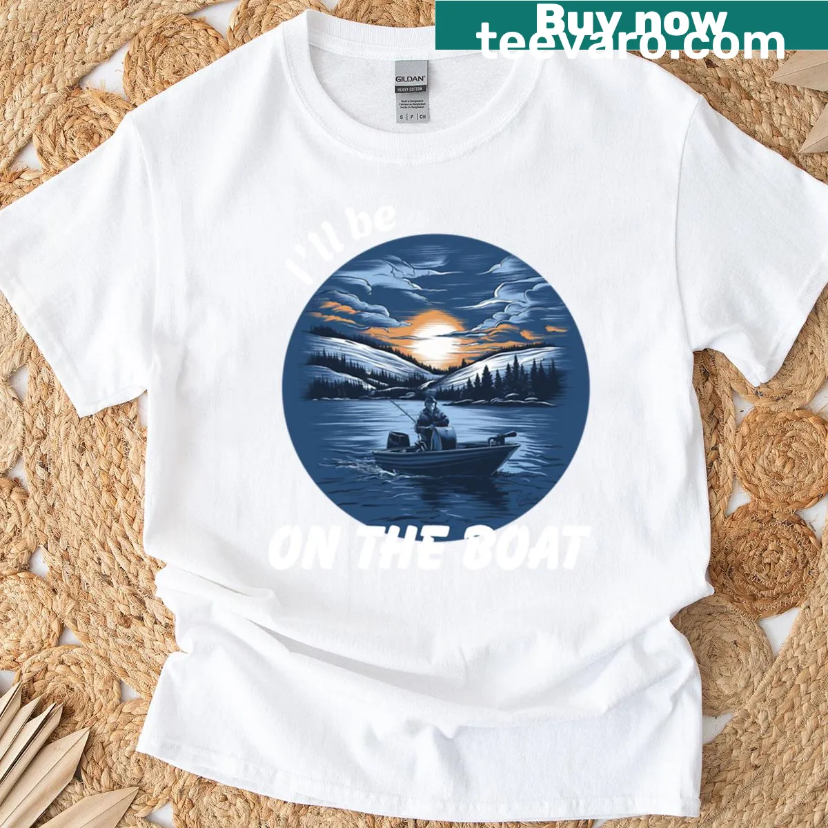Oversized T-shirt featuring a serene boat sunrise design — on a men's t-shirt