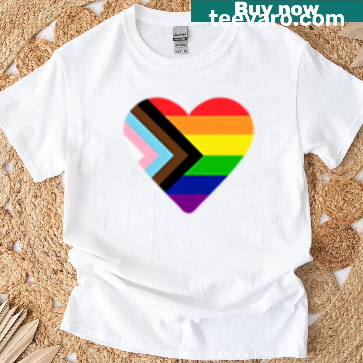 Heart graphic featuring the progress pride flag on a t-shirt. — on a men's t-shirt