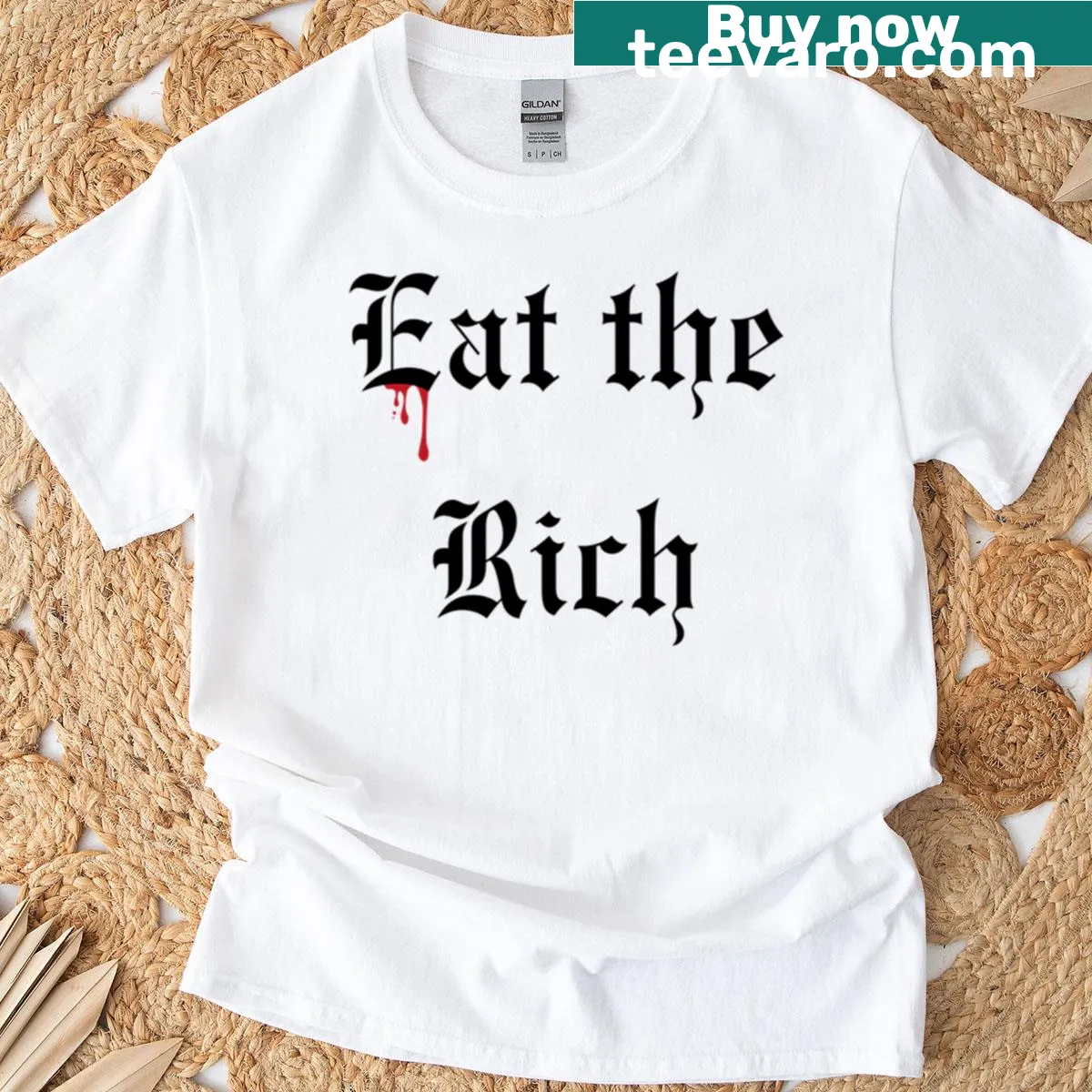 T-shirt featuring the phrase 'Eat The Rich' in bold letters — on a men's t-shirt