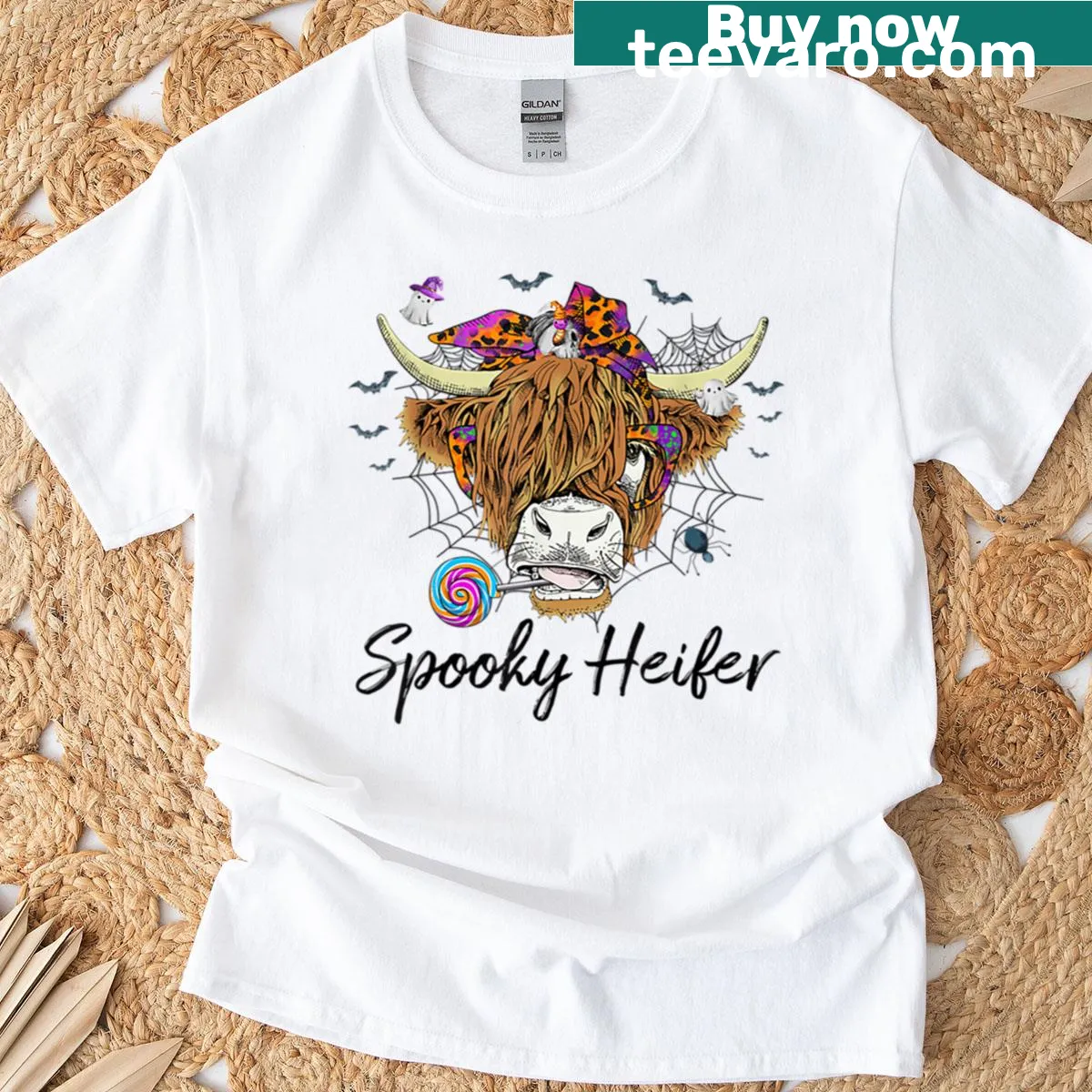 Highland cow with leopard spots and pumpkin design for Halloween — on a men's t-shirt