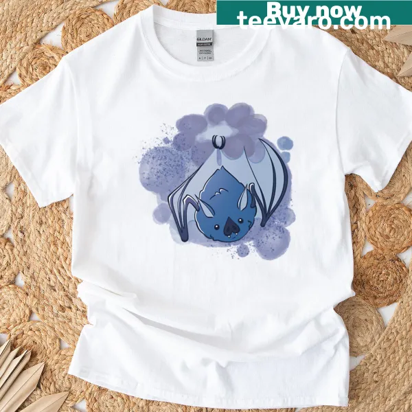 Cartoon bat surrounded by blueberries on a T-shirt.