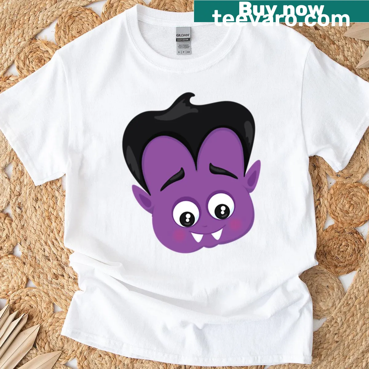 Cartoon T-shirt featuring a friendly purple baby vampire head illustration. — on a men's t-shirt