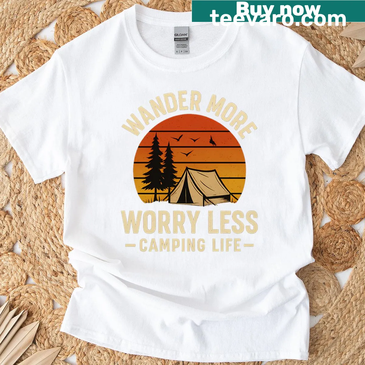 Illustrative camping scene with tent and motivational text on sunset background — on a men's t-shirt