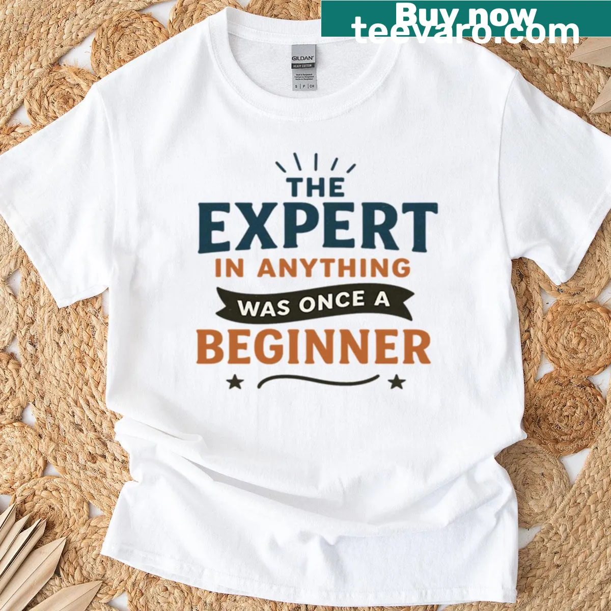 Inspirational tee stating 'The Expert In Anything Was Once A Beginner' — on a men's t-shirt