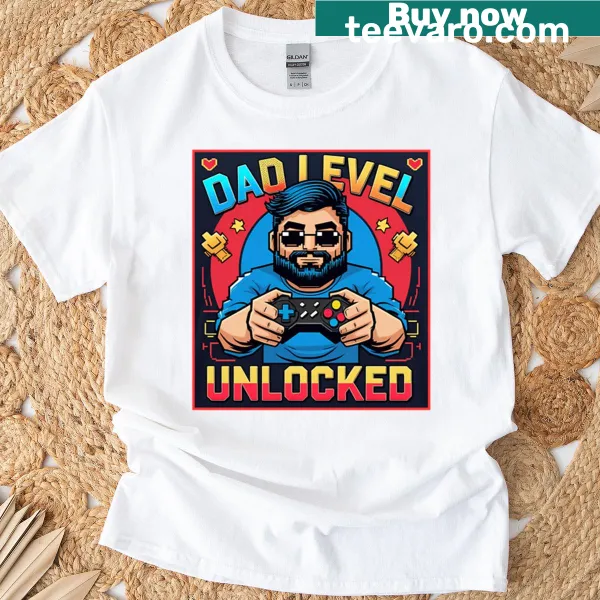 Humorous T-shirt celebrating fatherhood with 'Unlocked Dad Level' text