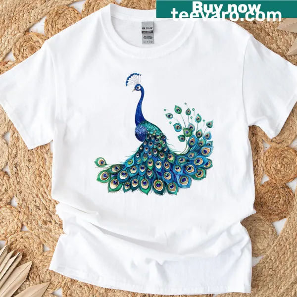 Blue peacock print t-shirt featuring teal feathers