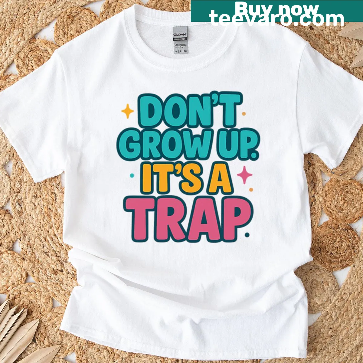 Playful T-shirt humorously claiming growing up is a trap — on a men's t-shirt