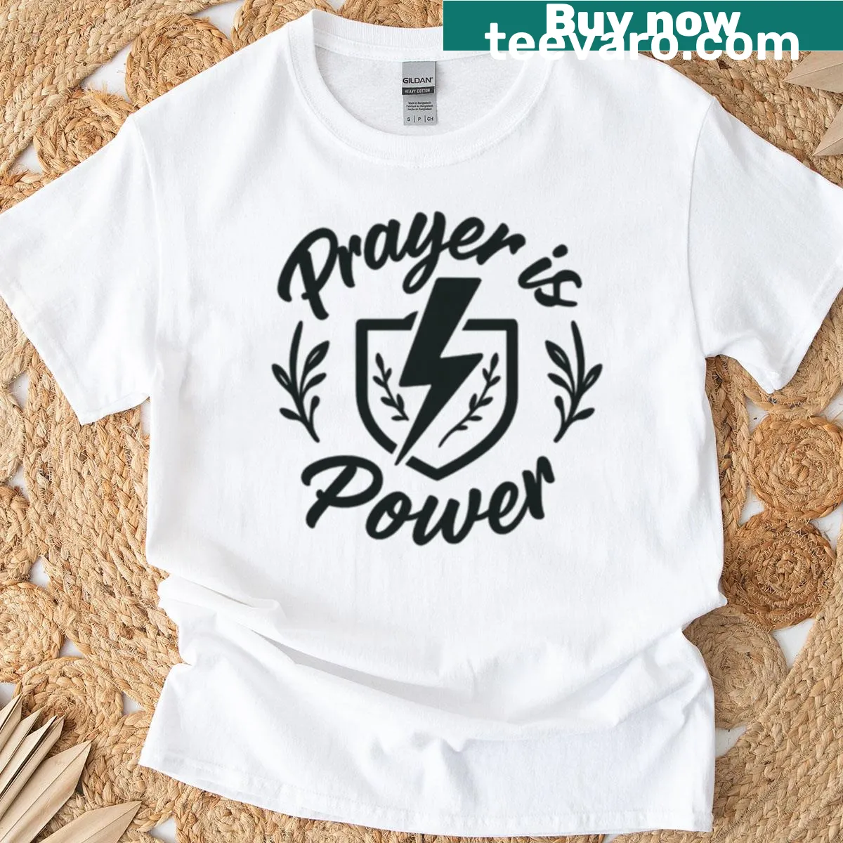 Bold faith T-shirt with lightning bolt and shield design — on a men's t-shirt