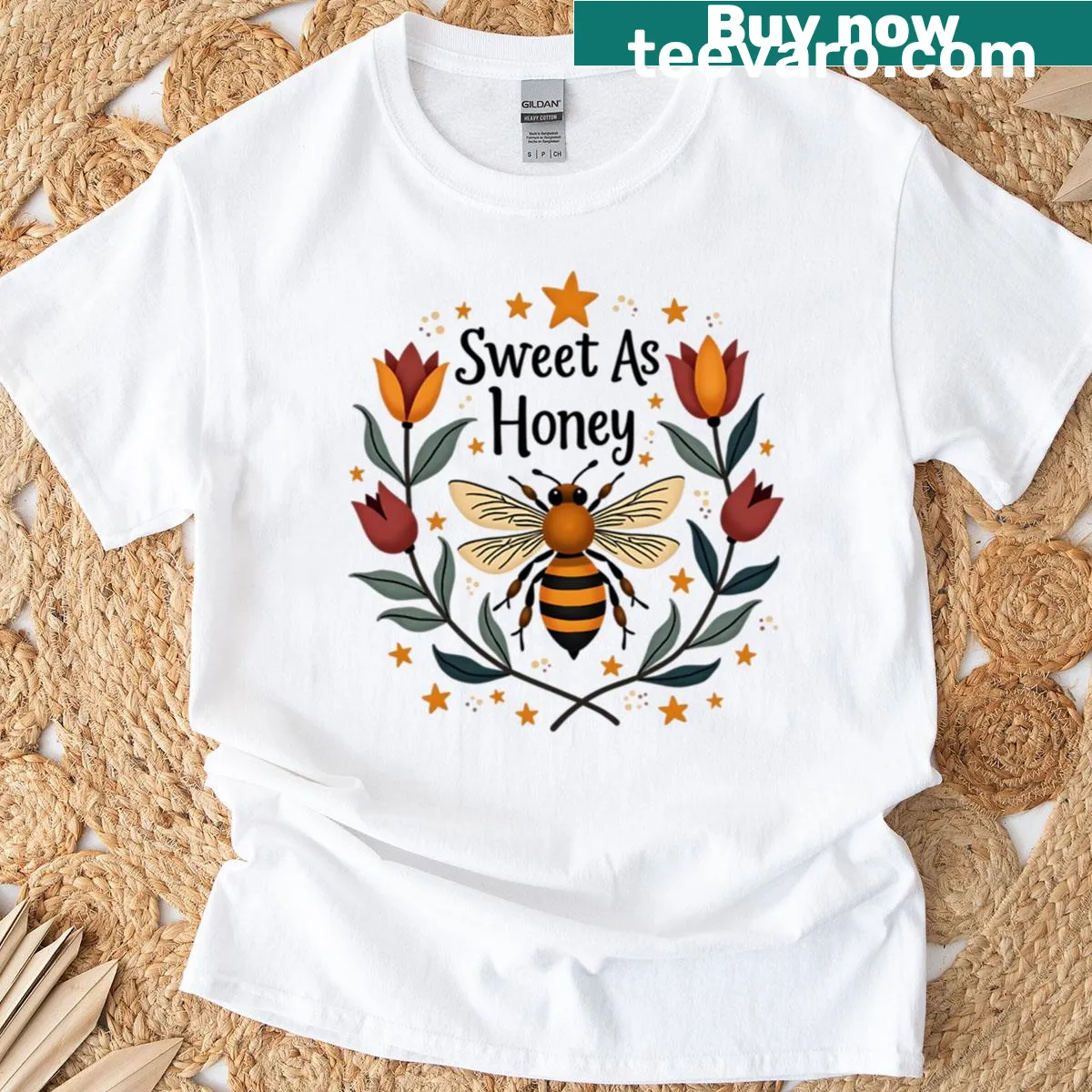 T-shirt featuring bee and flower illustration design — on a men's t-shirt