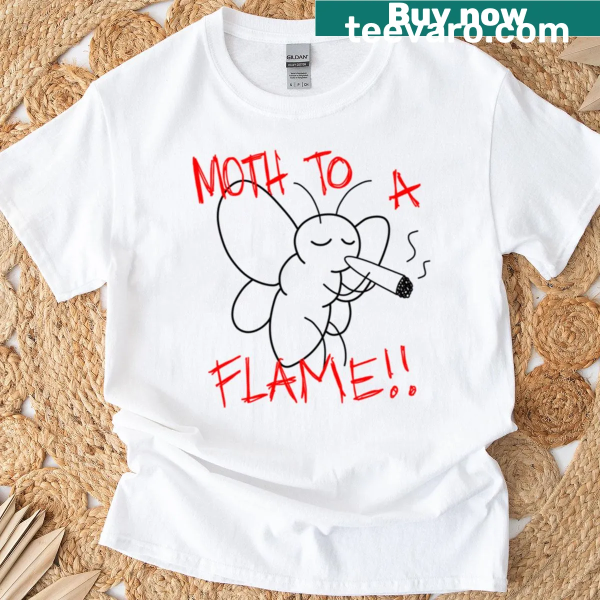 Illustrated moth drawn to flame on t-shirt — on a men's t-shirt