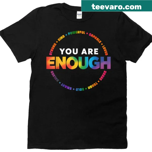 Pride-themed t-shirt featuring 'You Are Enough' text and a rainbow flag design.