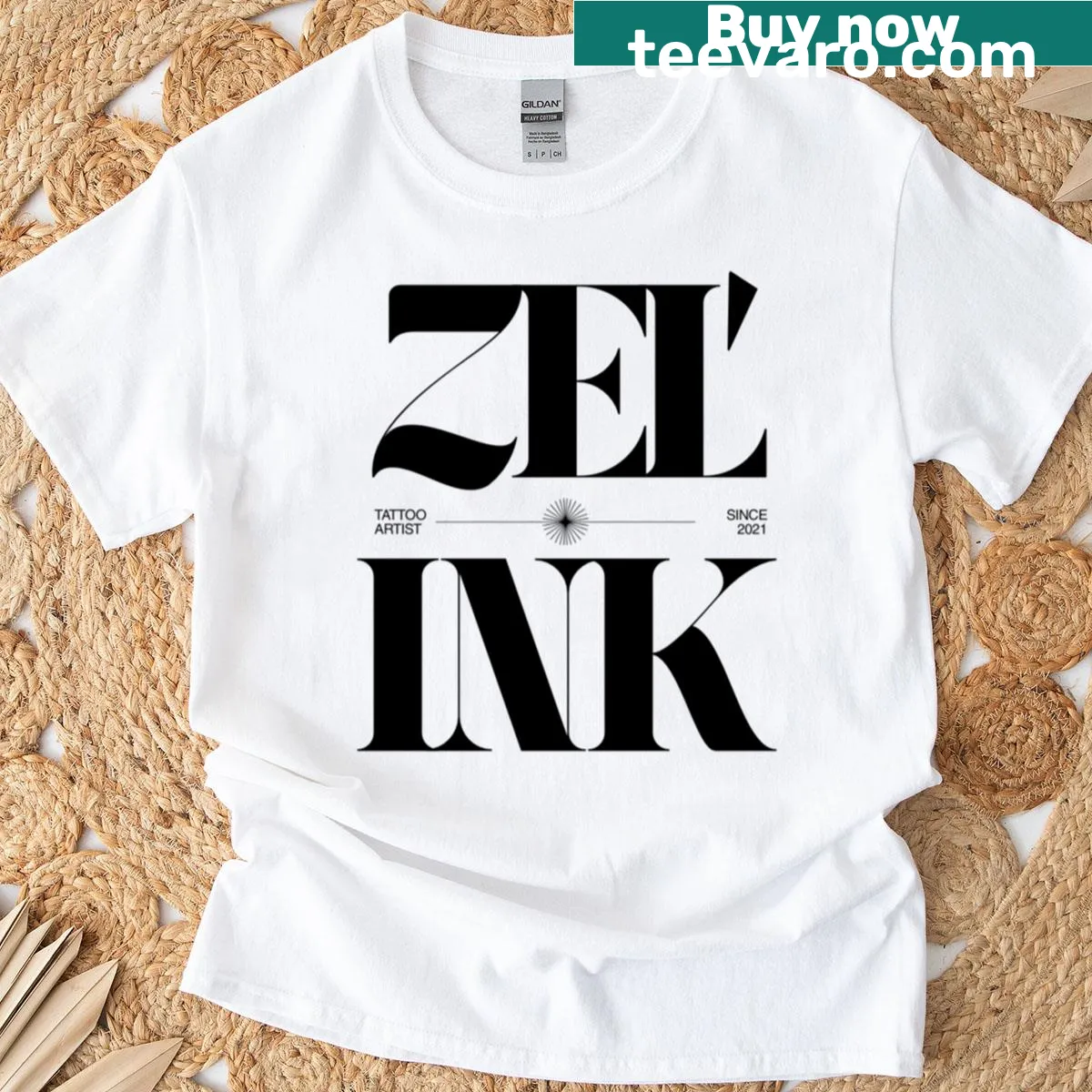Zelink logo badge on a tattoo artist t-shirt — on a men's t-shirt