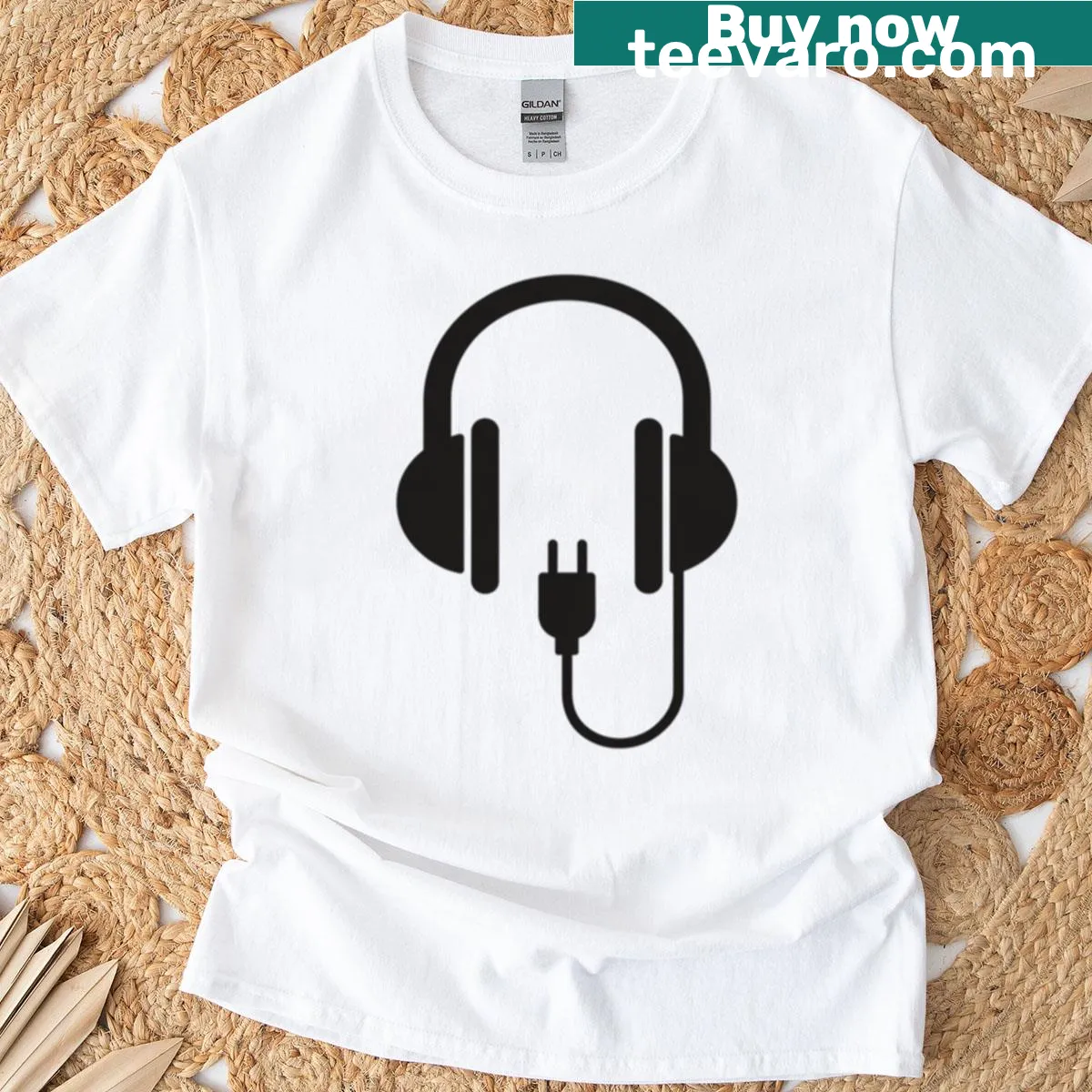 Minimalist t-shirt featuring headphones and audio plug icon — on a men's t-shirt