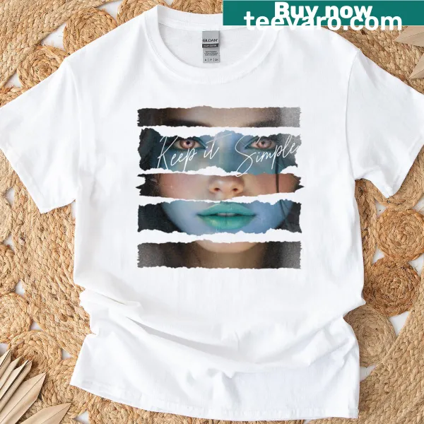 Teal t-shirt with a ripped graphic design focusing on minimalism.