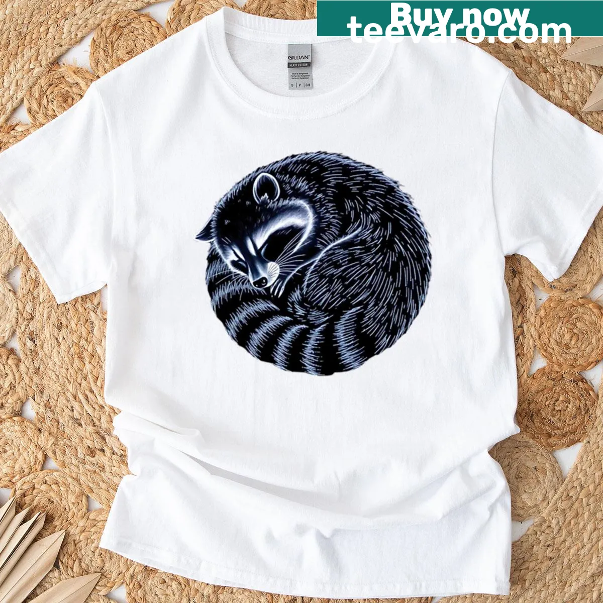 Illustrative T-shirt featuring a sleeping raccoon graphic — on a men's t-shirt