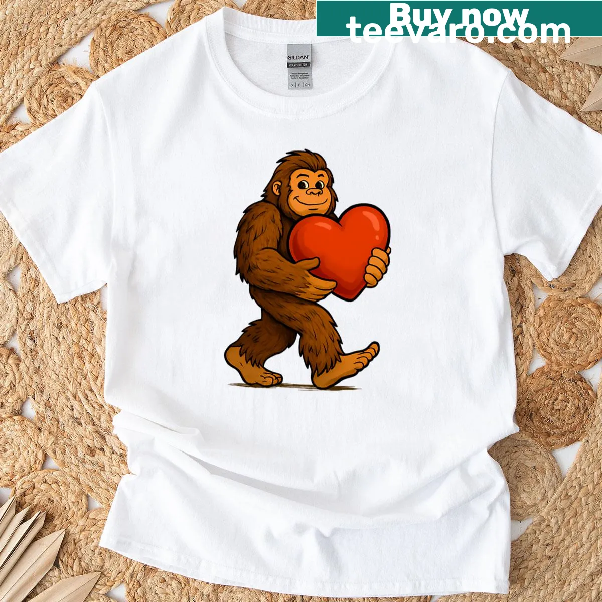Cartoon Bigfoot holding a heart for Valentine's Day T-shirt — on a men's t-shirt