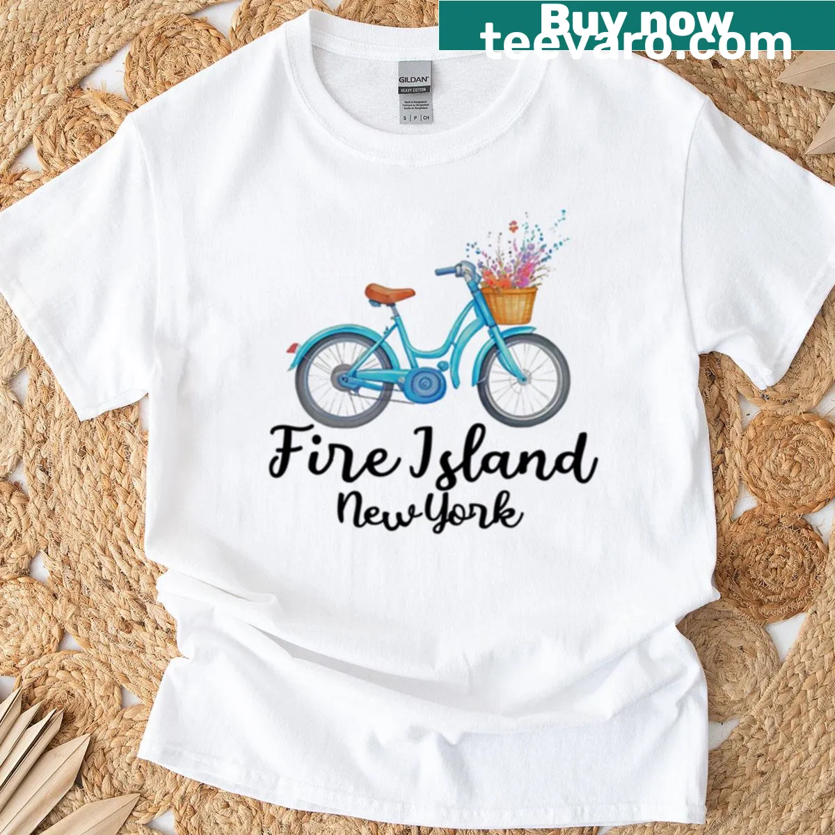 T-shirt featuring a whimsical beach and bicycle graphic — on a men's t-shirt