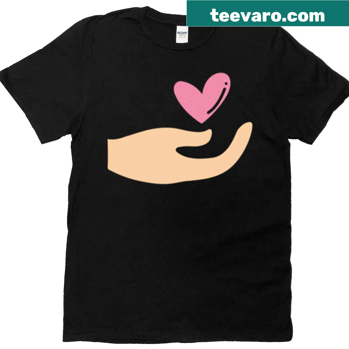 Minimalist T-shirt with hand holding heart graphic promoting kindness — on a men's t-shirt