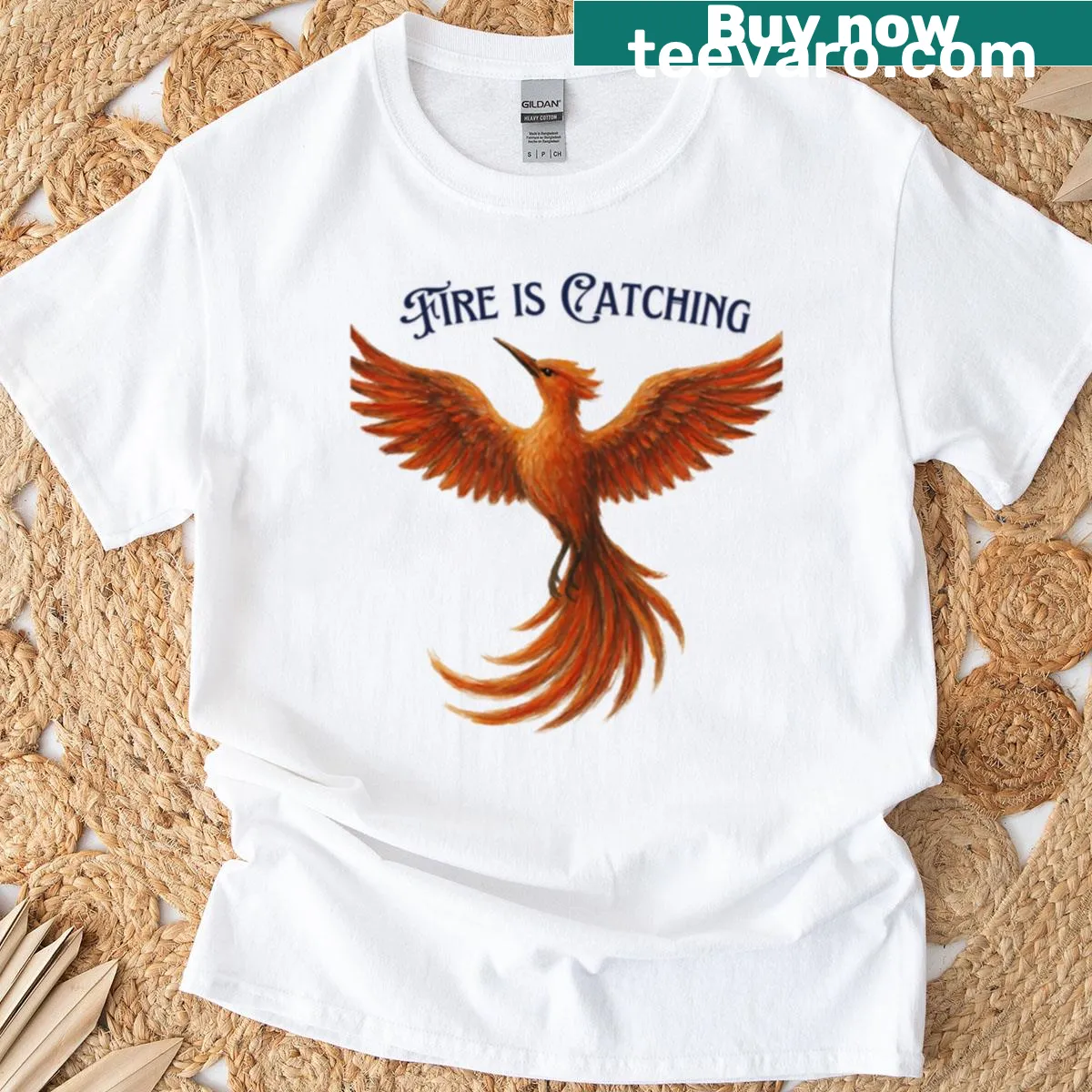 Bold Mockinjay symbol printed on a T-shirt, representing rebellion. — on a men's t-shirt