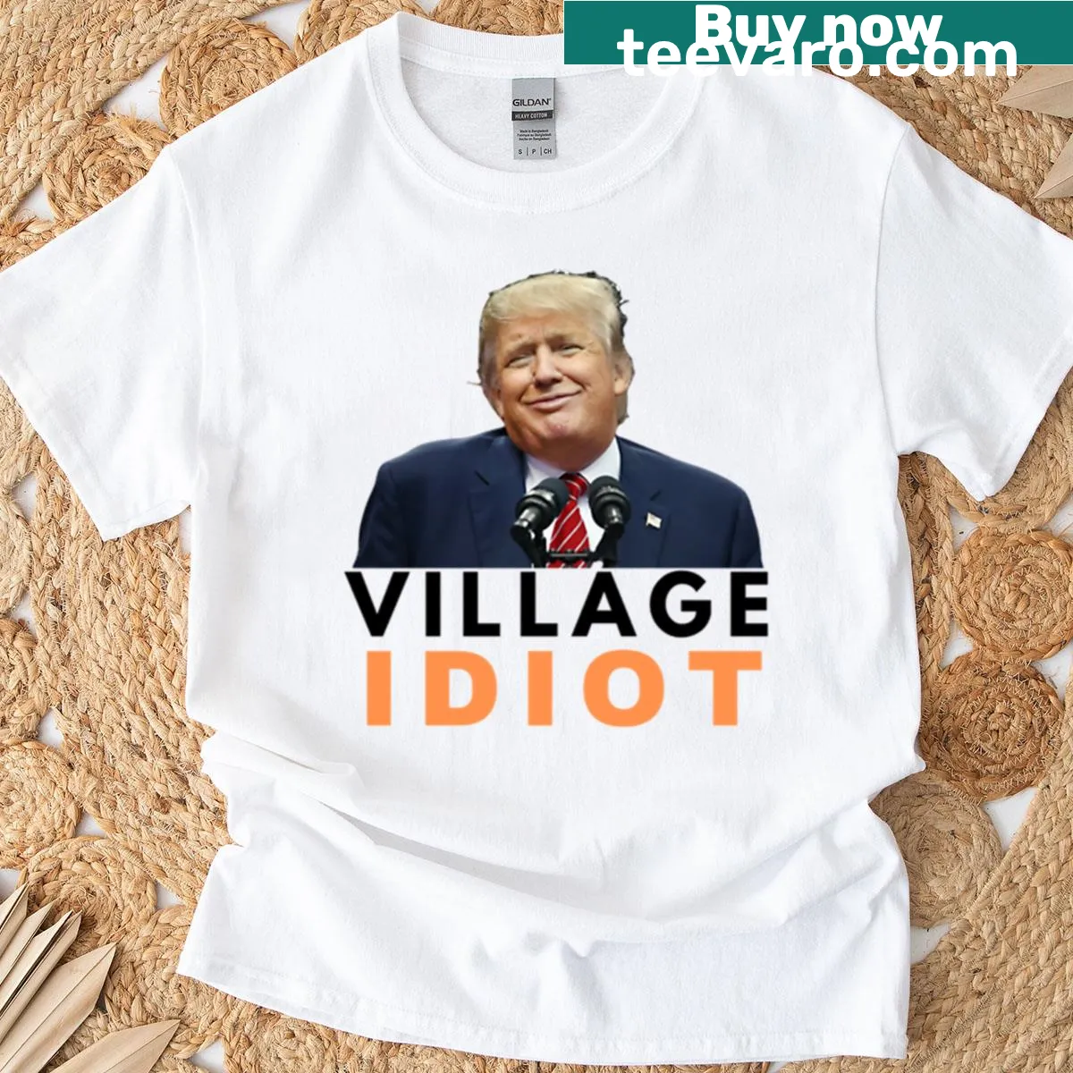 T-shirt with bold text 'Village Idiot' — on a men's t-shirt