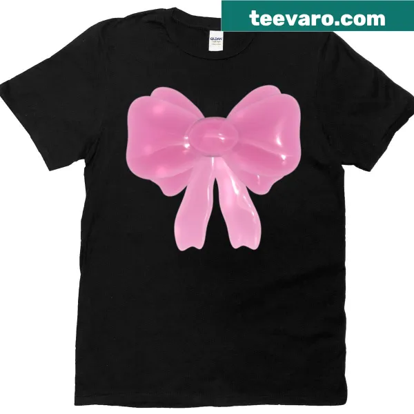 Stylish pink bow graphic on a T-shirt reminiscent of Y2K aesthetics.
